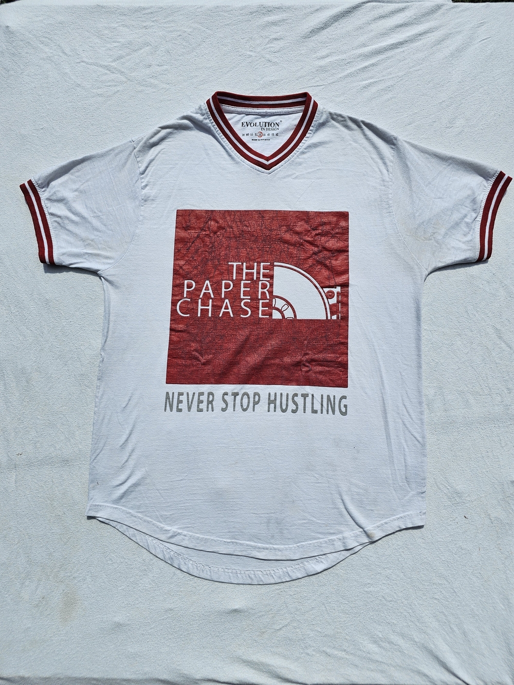 Evolution 'The Paper Chase' White Short Sleeve Tee with Red Graphic